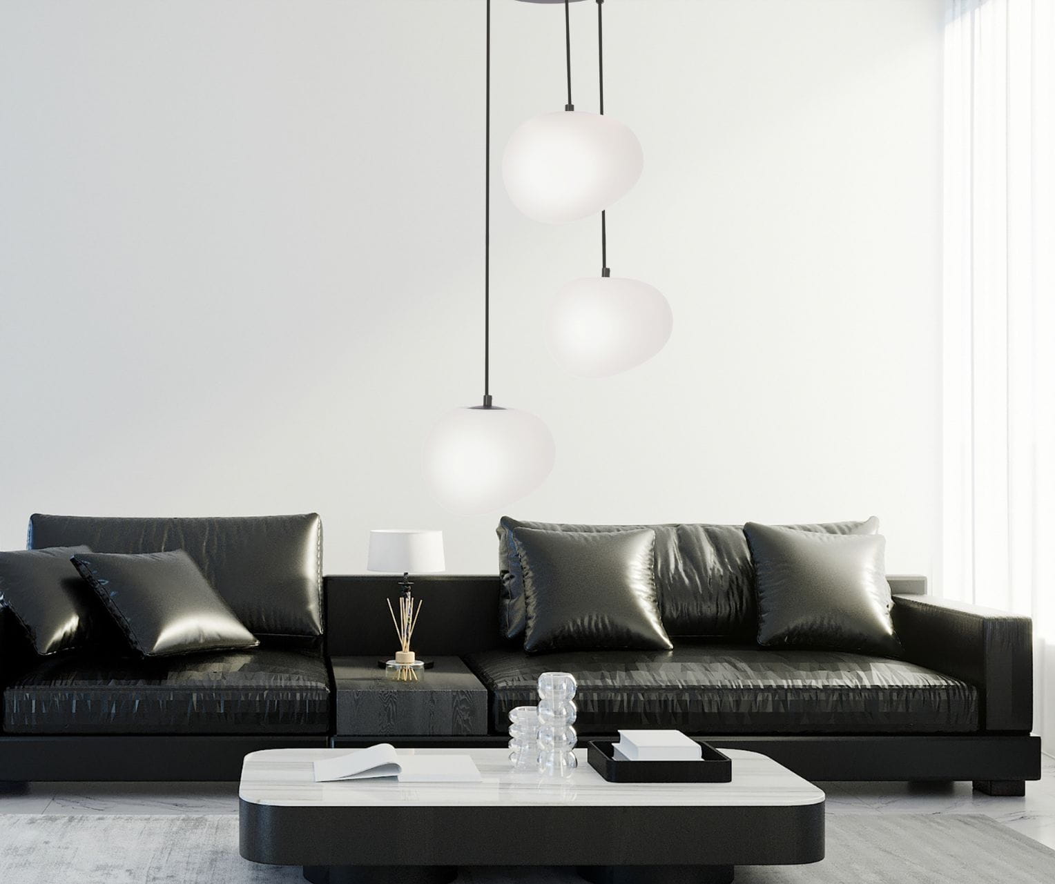 Lampa wisząca Stone 3 na okrągłej podsufitce zawieszona w salonie urządzonym w tonacji czerni i bieli.jpg