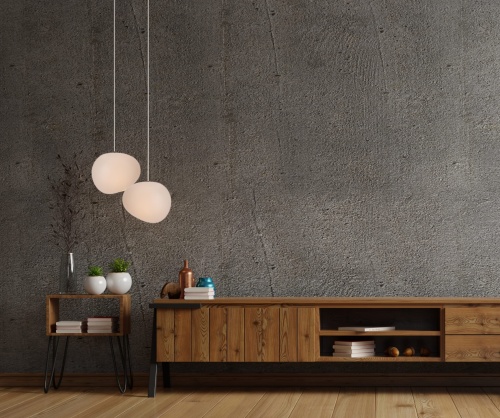 Dwie-lampy-wiszace-Stones-25-cm-w-salonie-na-tle-betonowej-sciany.jpg