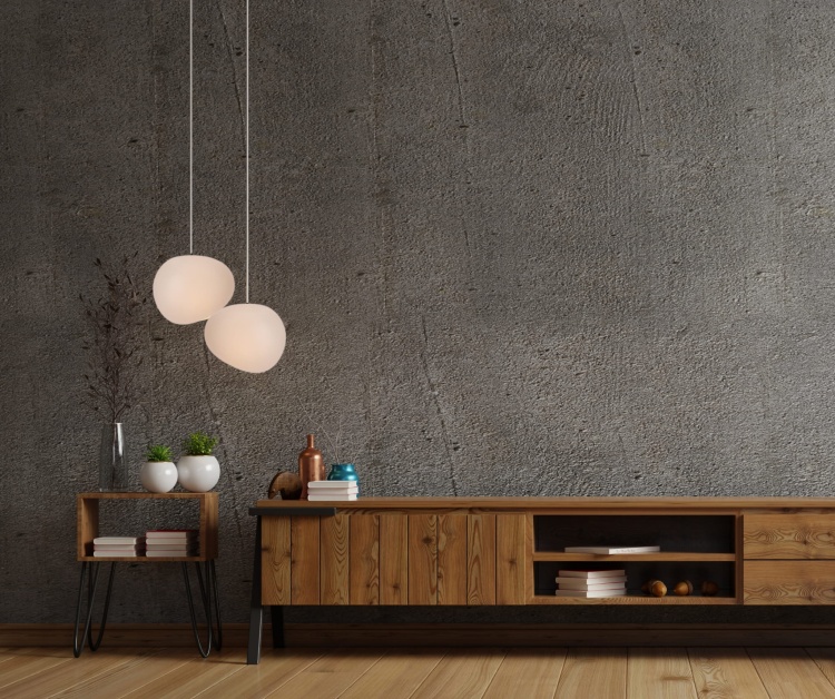 Dwie-lampy-wiszace-Stones-25-cm-w-salonie-na-tle-betonowej-sciany.jpg