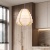 Lampa-wiszaca-Nagoja-zawieszona-w-salonie-zblizenie.jpg