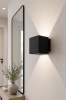Kinkiet Cube black na ścianie przy lustrze